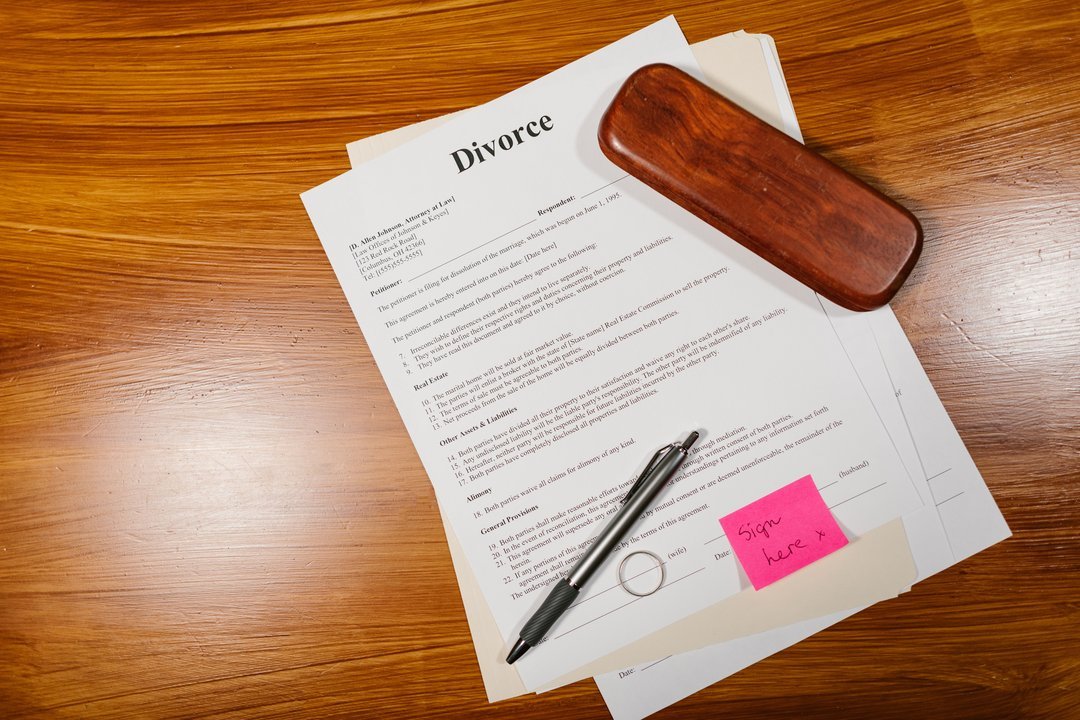 Divorce papers and wedding ring on a desk, documents for recognition of foreign divorce in Davao